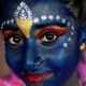 A student participates in Janmashtami celebrations in Mumbai.